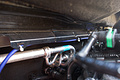 Then it runs through the engine compartment to the passenger side...